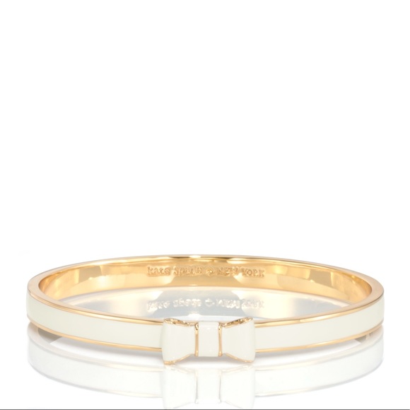 Kate Spade gold and white bangle with bow